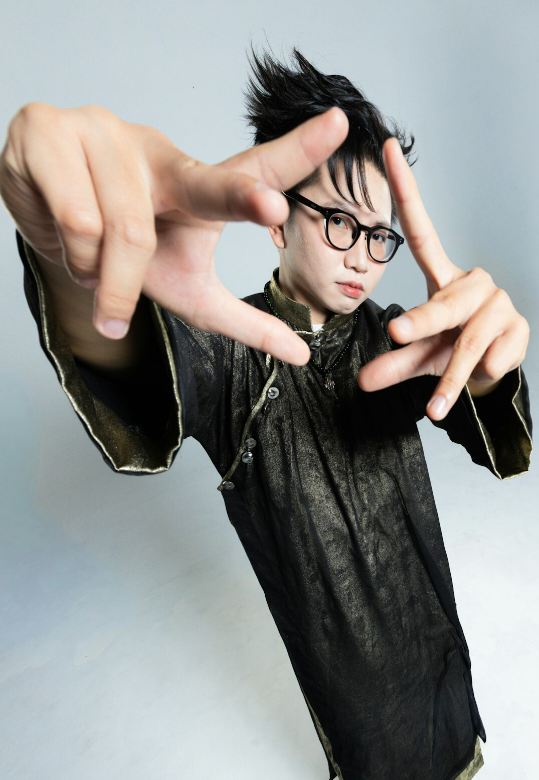Portrait of a young man with glasses in a creative studio