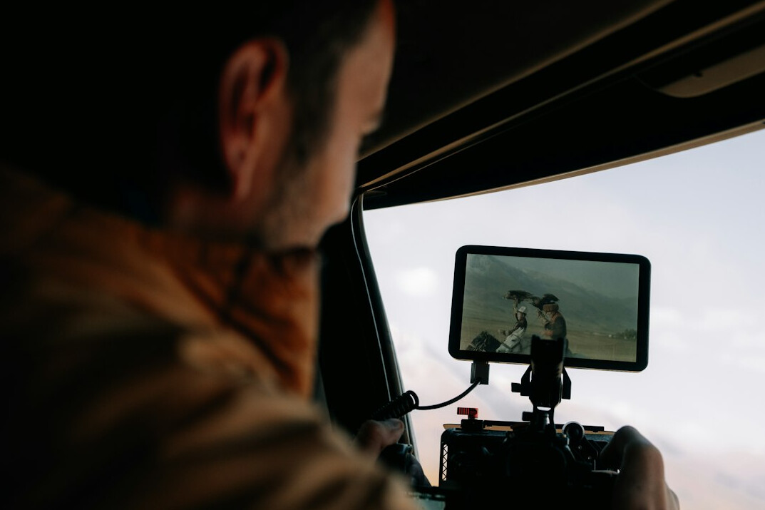 filmmaker reviewing footage on monitor